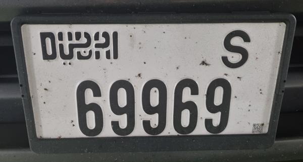 Dubai, UAE seen in Prague, Czech Republic. Photo taken on 15.11.2025. A long way from home, yet this car has been hanging around here for a couple of weeks. It has moved a few times though, so it's not abandoned. I don't even want to imagine what the parking cost for that time must be. Close-up photo of the front plate.